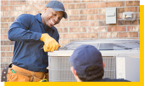 aircon specialists fixing outside unit