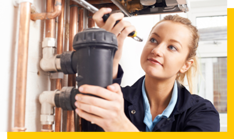 gas and heating engineer servicing boiler